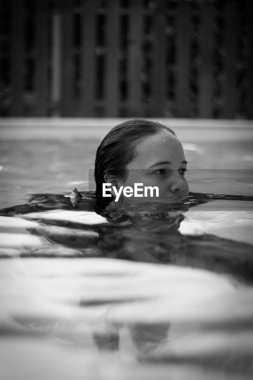 WOMAN SWIMMING IN POOL