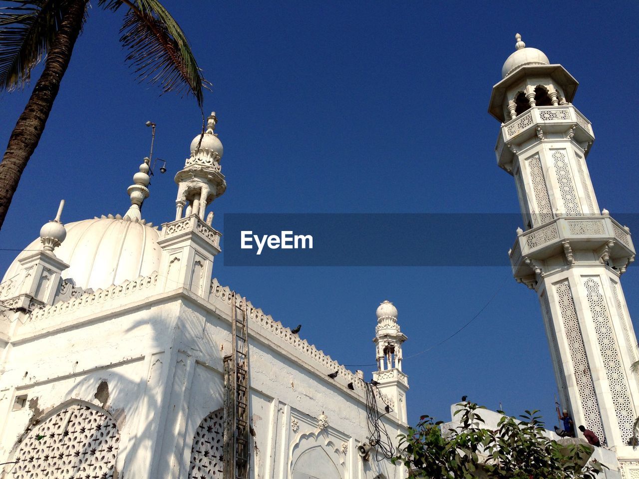 LOW ANGLE VIEW OF CHURCH AGAINST CLEAR BLUE SKY