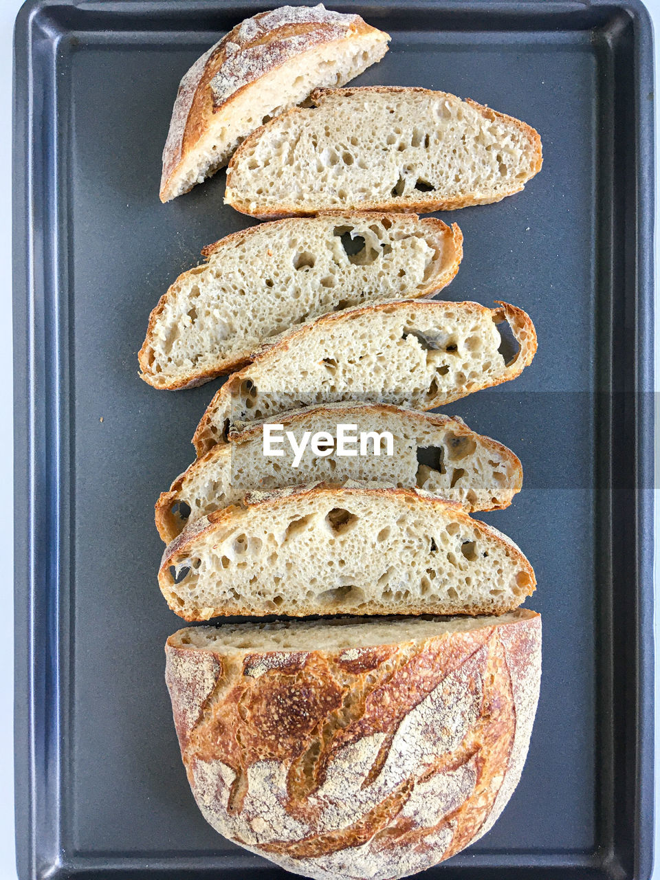 DIRECTLY ABOVE SHOT OF BREAD ON GLASS TABLE