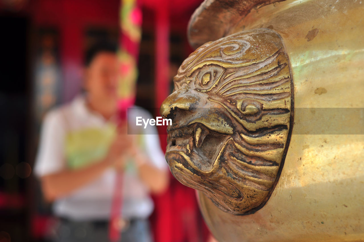 People with burner incense in hand pray at jin de yuan temple, jakarta, indonesia