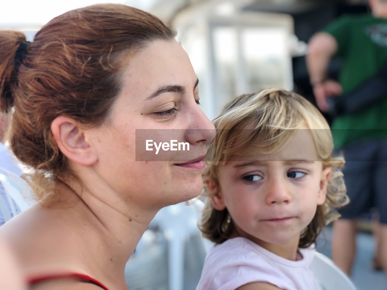 Close-up of mother and daughter outdoors