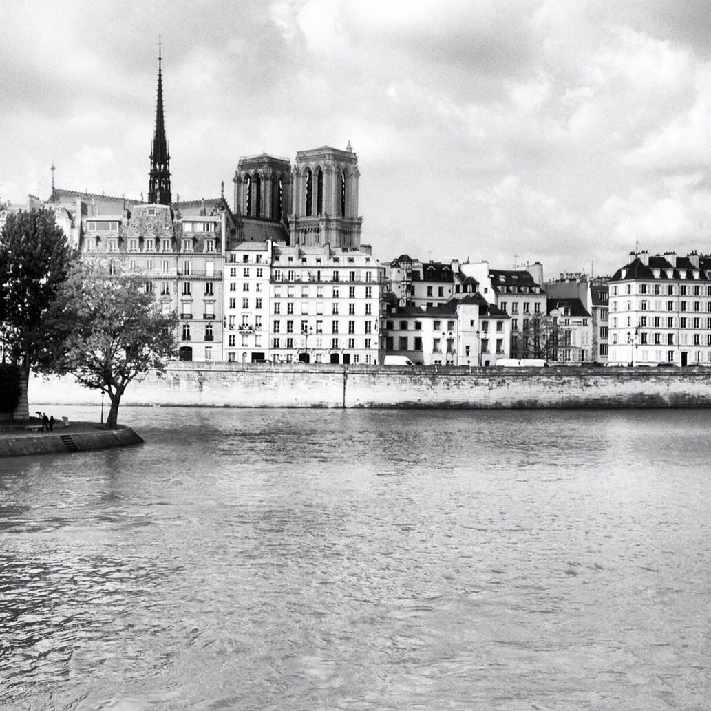 RIVER WITH BUILDINGS IN BACKGROUND