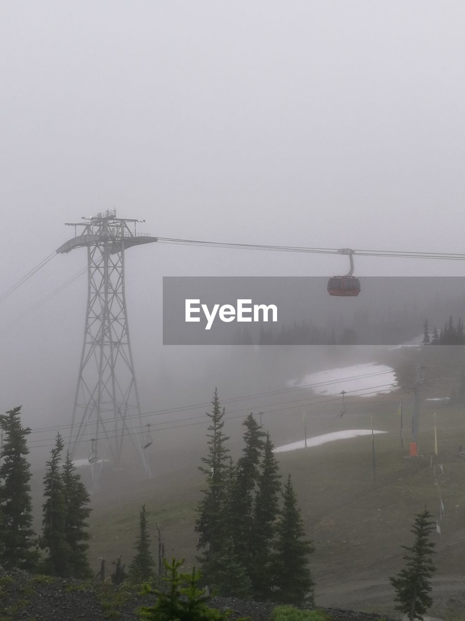 Electricity pylon in foggy weather