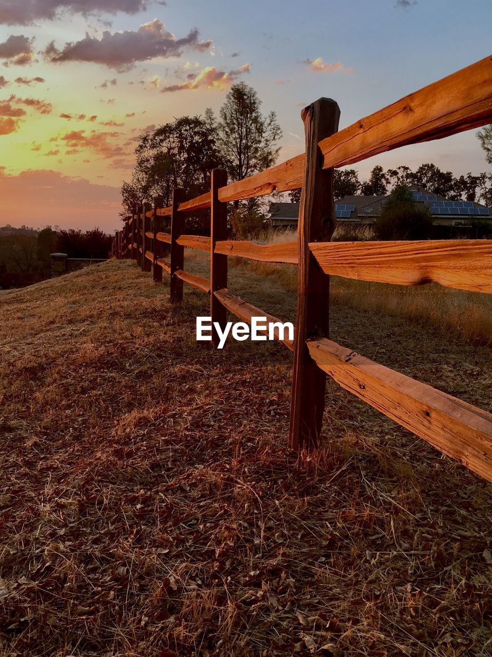 Close-up of barn on field against sky