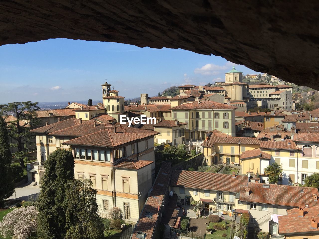 Cityscape seen through old window