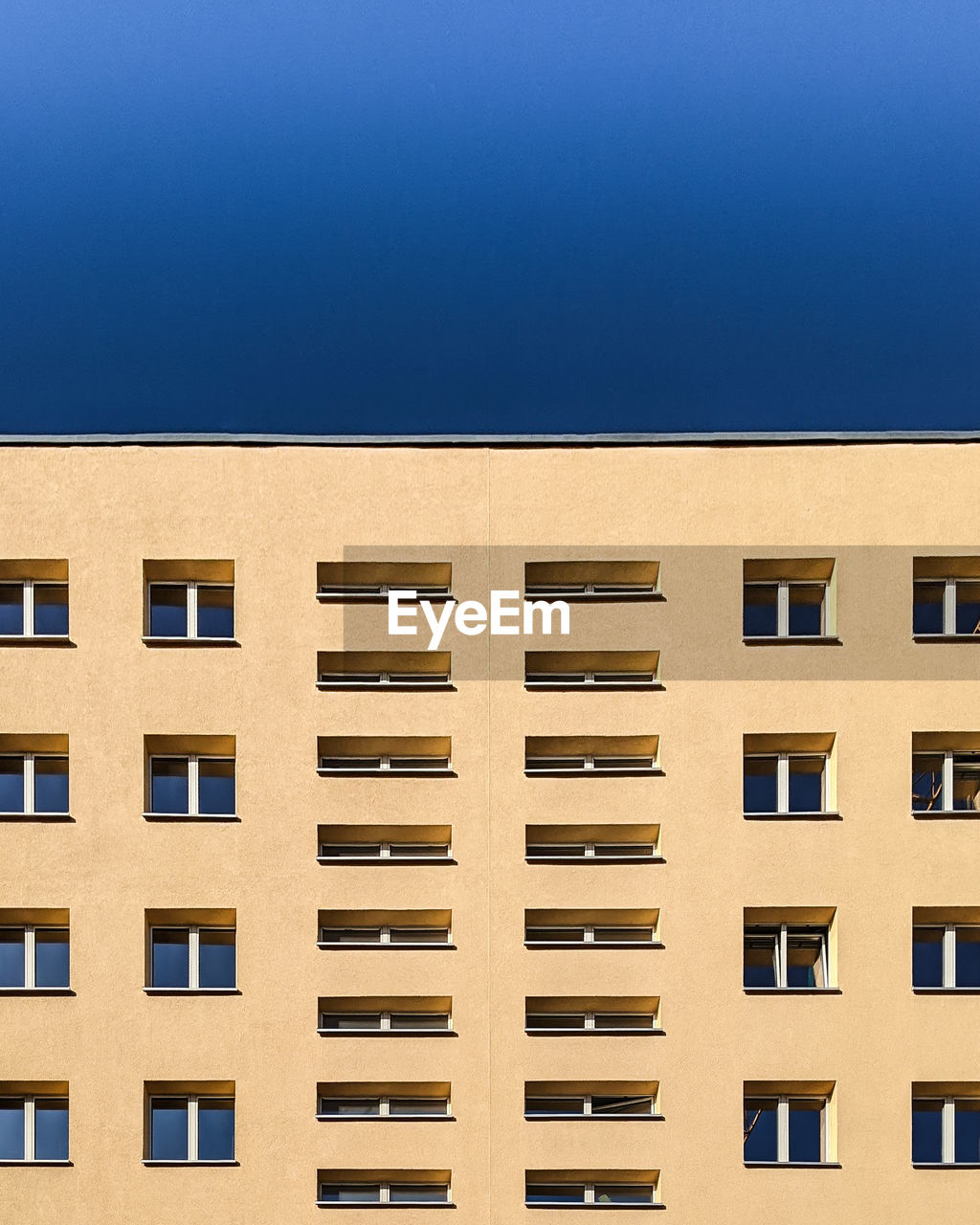 Low angle view of building against blue sky