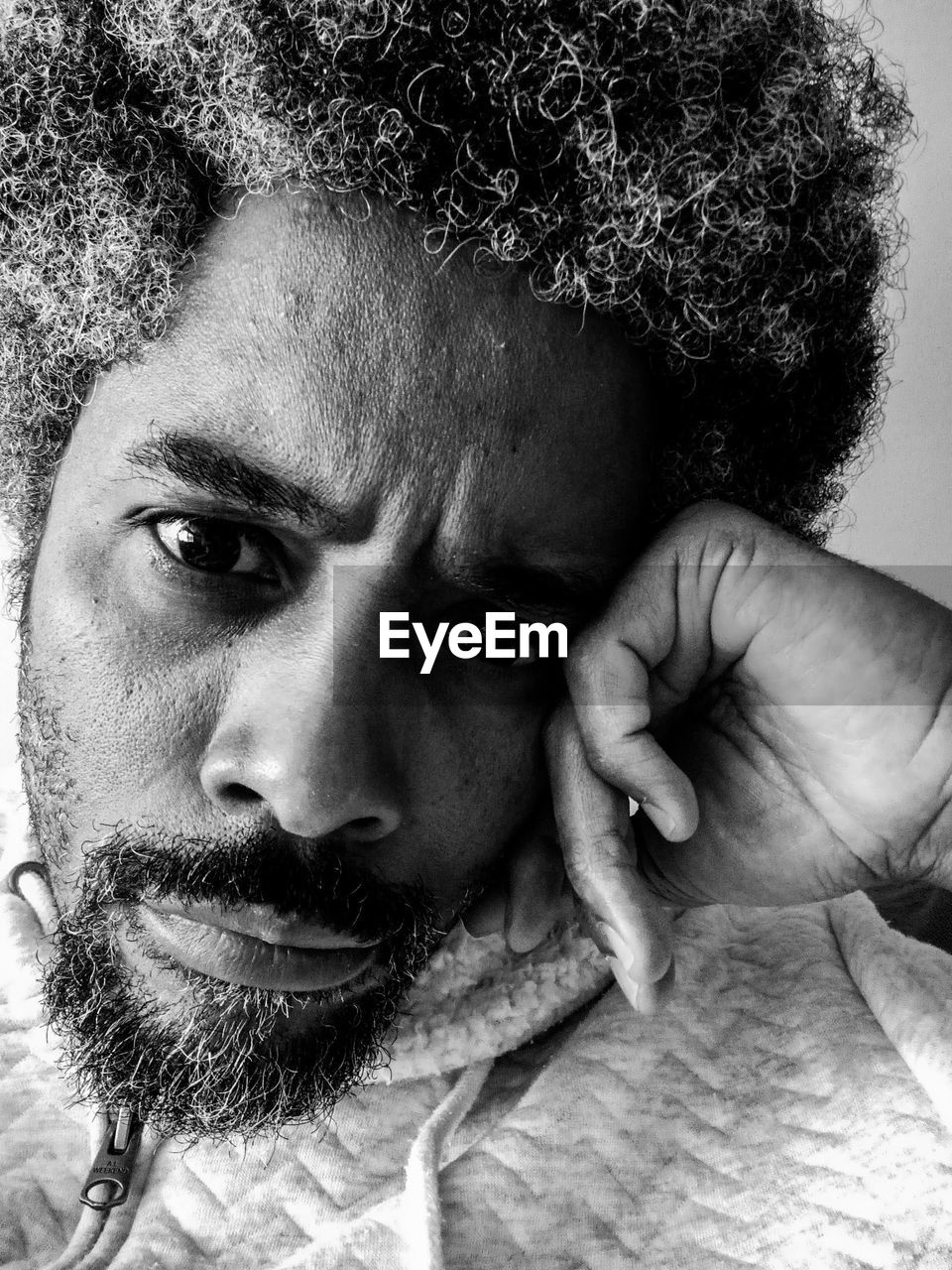 portrait, one person, adult, black and white, headshot, human hair, looking at camera, men, beard, monochrome photography, facial hair, monochrome, hairstyle, close-up, young adult, human face, lifestyles, indoors, front view, person, afro, serious, black, leisure activity, human head