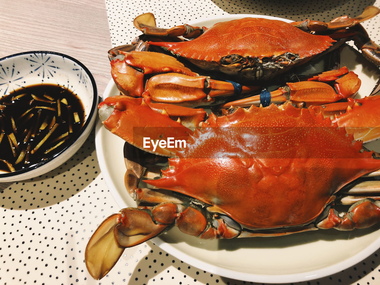 Close-up of crabs in plate on table