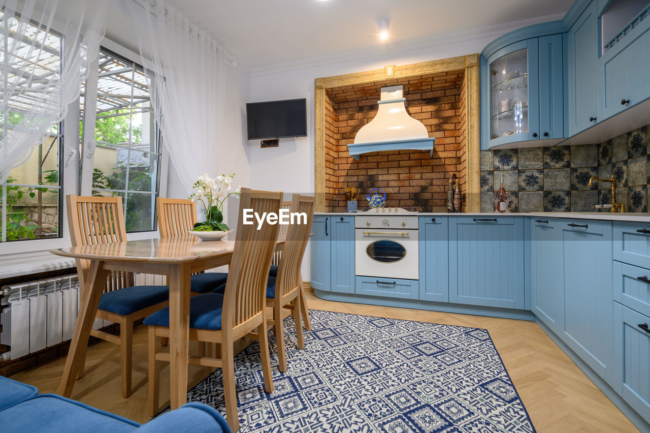 Empty chairs and tables at kitchen