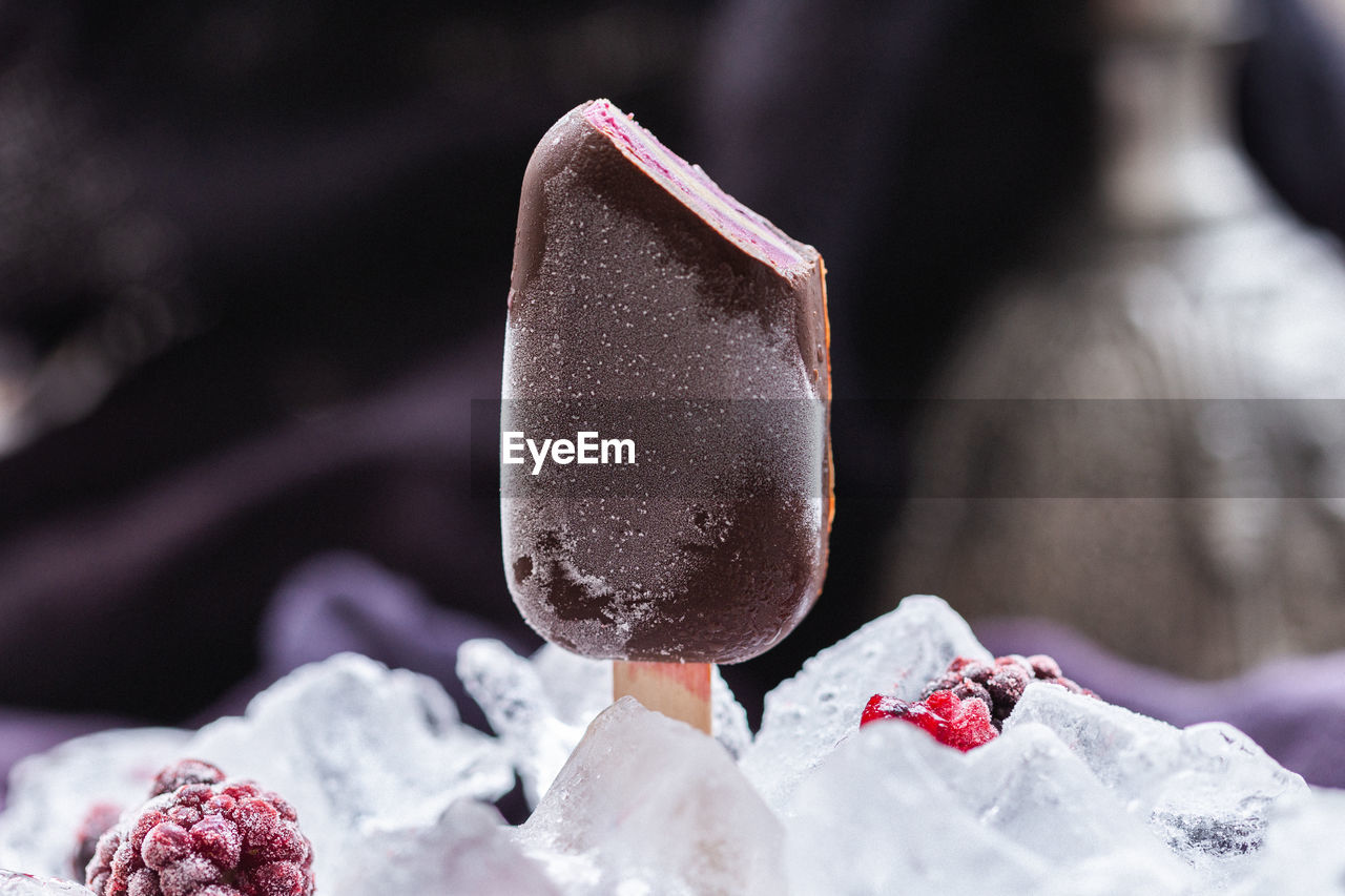 CLOSE-UP OF ICE CREAM IN SNOW