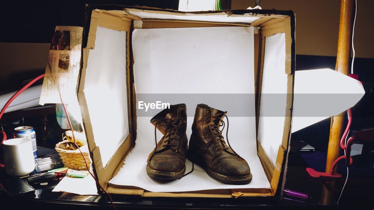 Close-up of shoes in box on table
