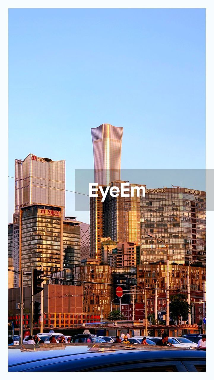 buildings in city against clear sky