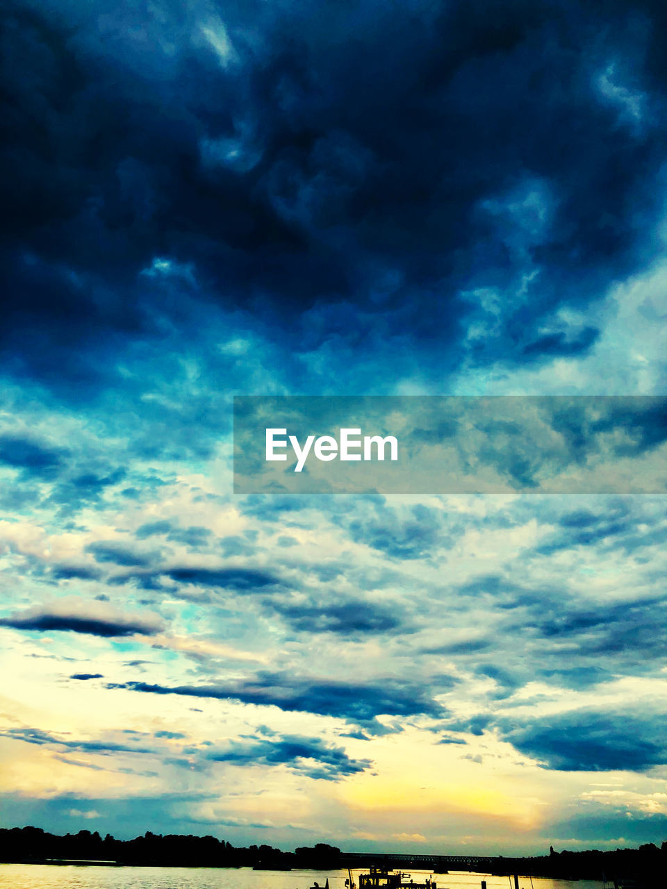 LOW ANGLE VIEW OF DRAMATIC SKY OVER LANDSCAPE