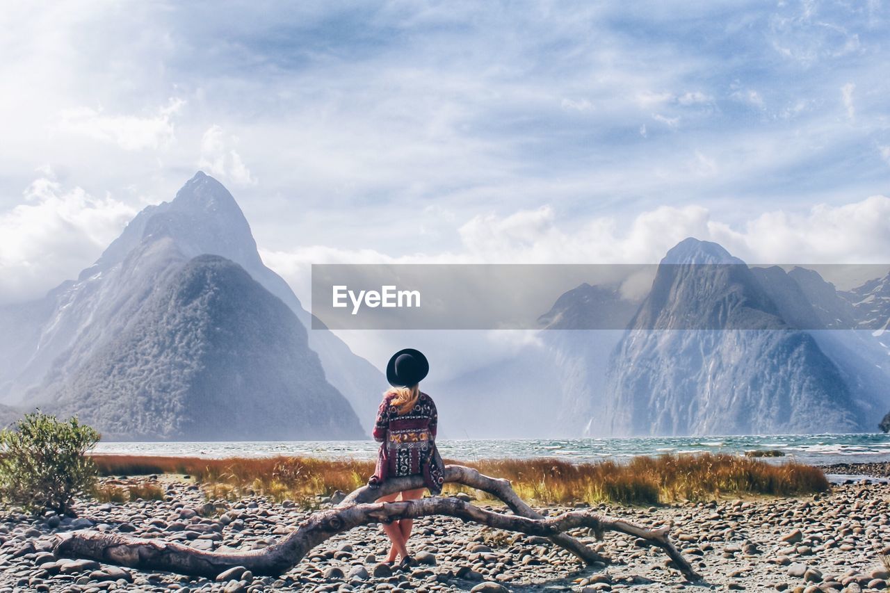 Rear view of woman looking at milford sound