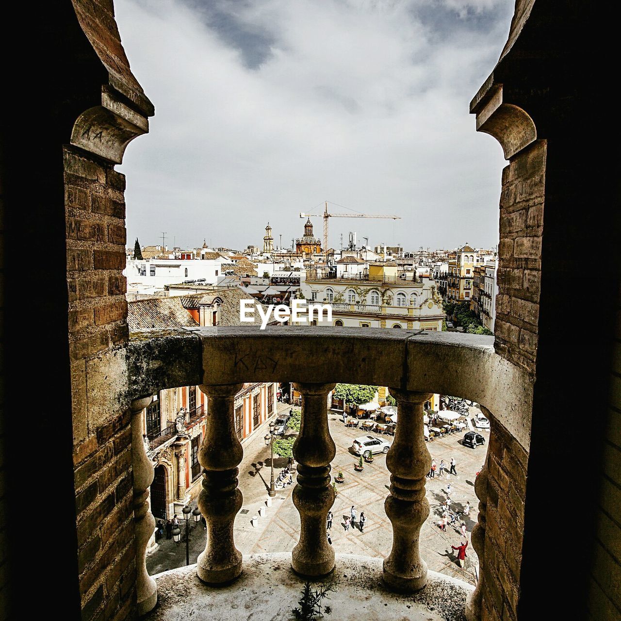 Cityscape against sky seen from balcony of old building