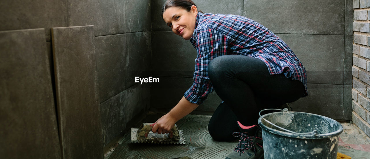 Portrait of woman working at construction site