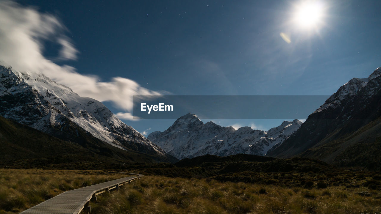 SCENIC VIEW OF MOUNTAIN AGAINST SKY AT NIGHT