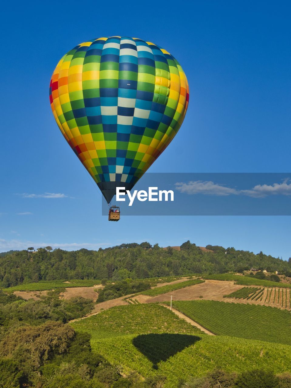 Hot air balloon flying over land