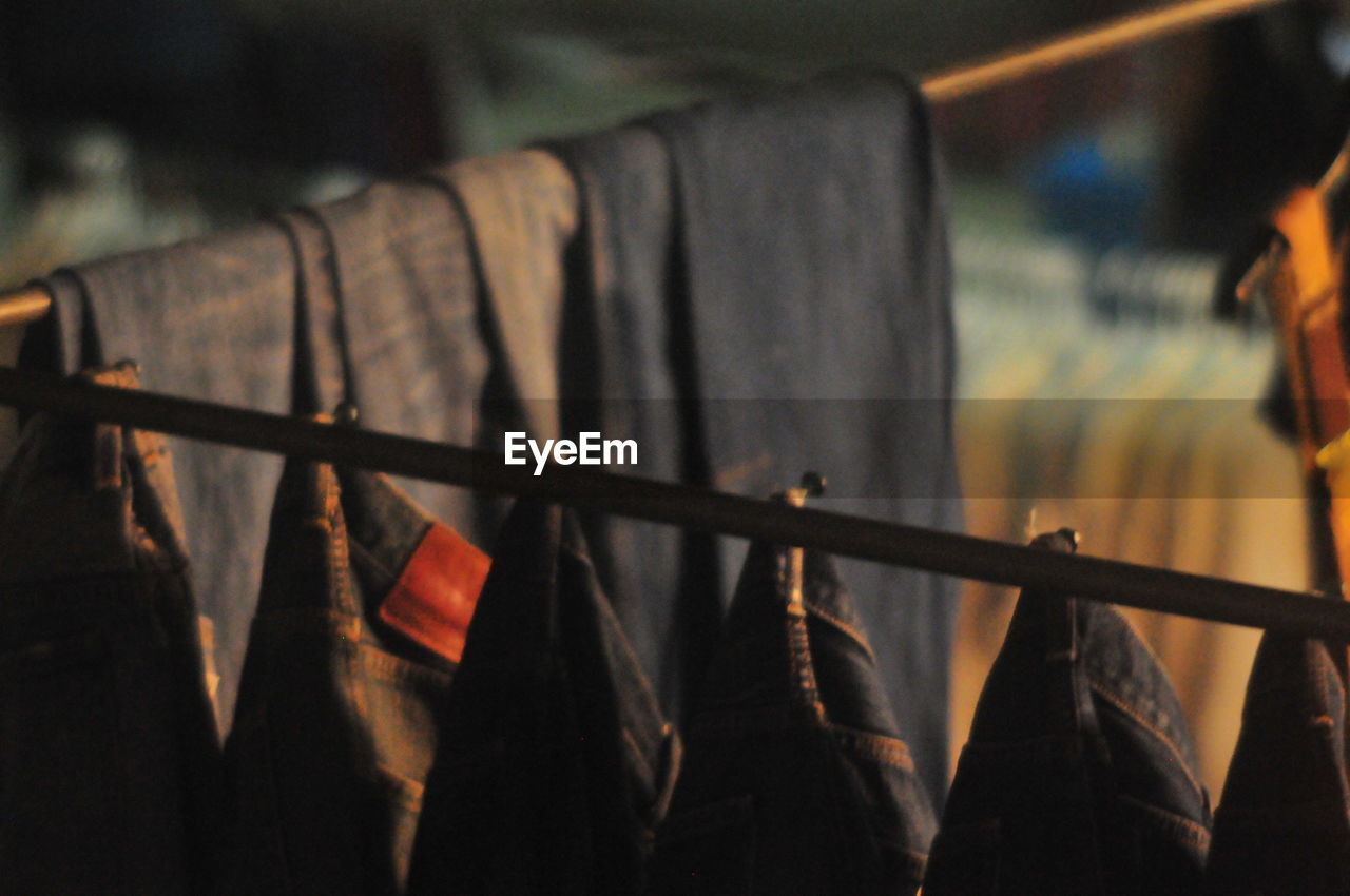 Low angle view of clothes hanging on wall