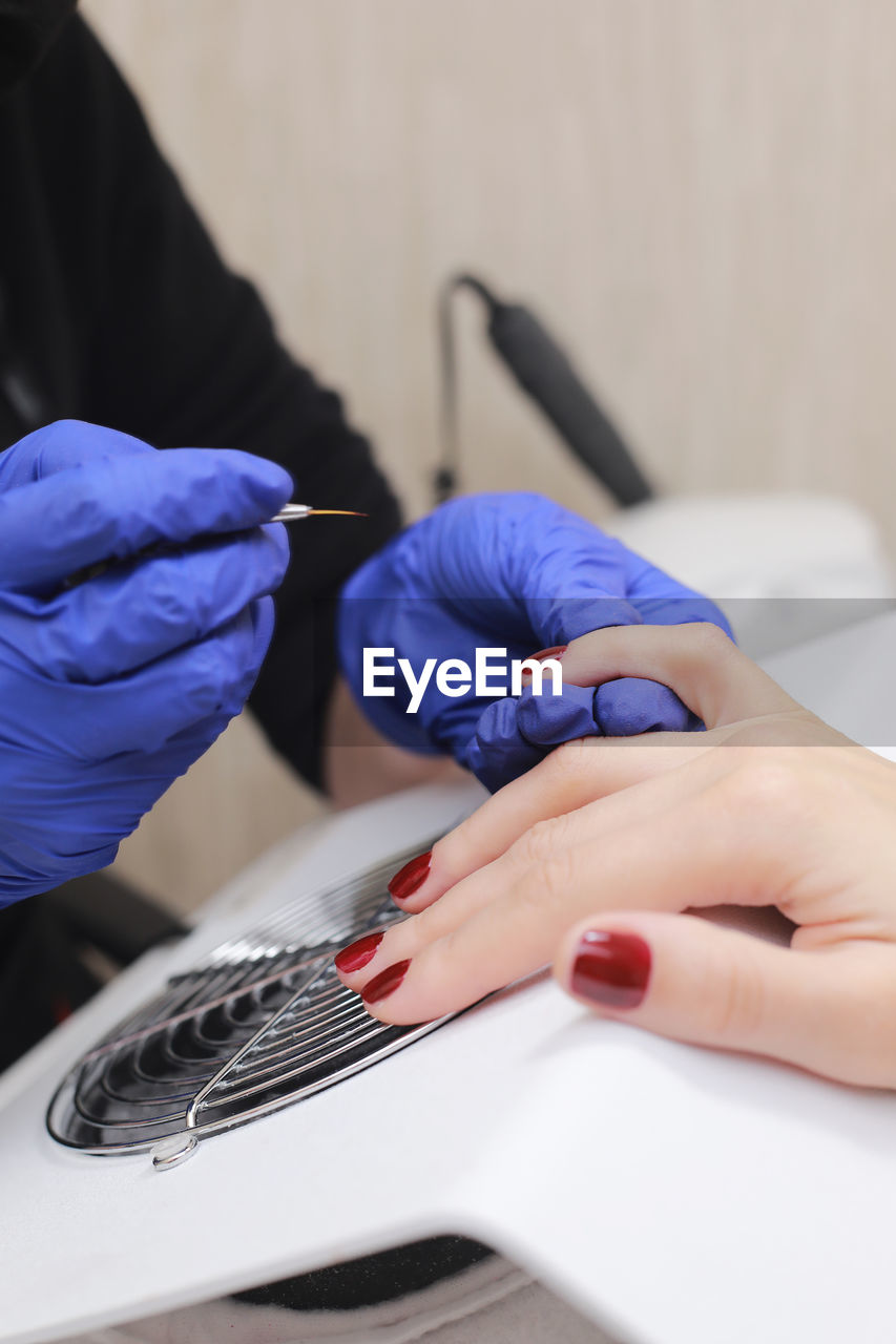 midsection of doctor examining patient in clinic