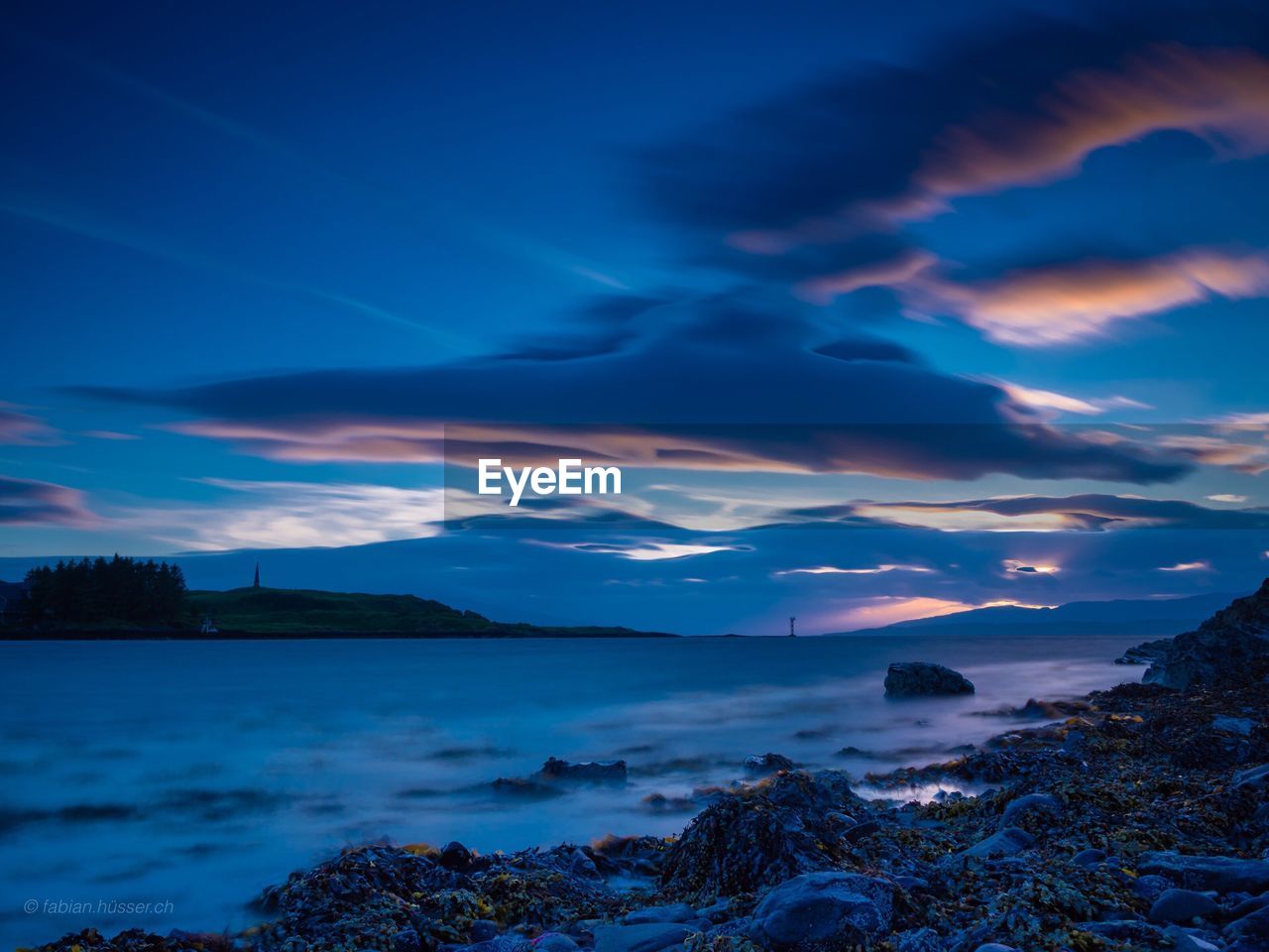 Scenic view of sea against dramatic sky