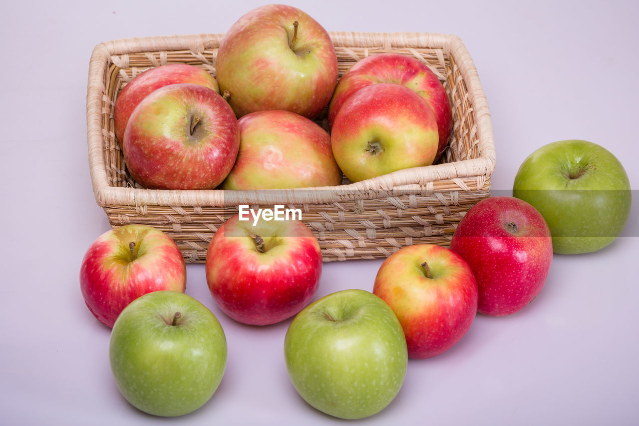 apple, healthy eating, food and drink, food, fruit, apple - fruit, freshness, wellbeing, granny smith, produce, studio shot, basket, plant, container, red, group of objects, no people, indoors, still life, cut out, large group of objects, green, granny smith apple, close-up, organic, group, variation