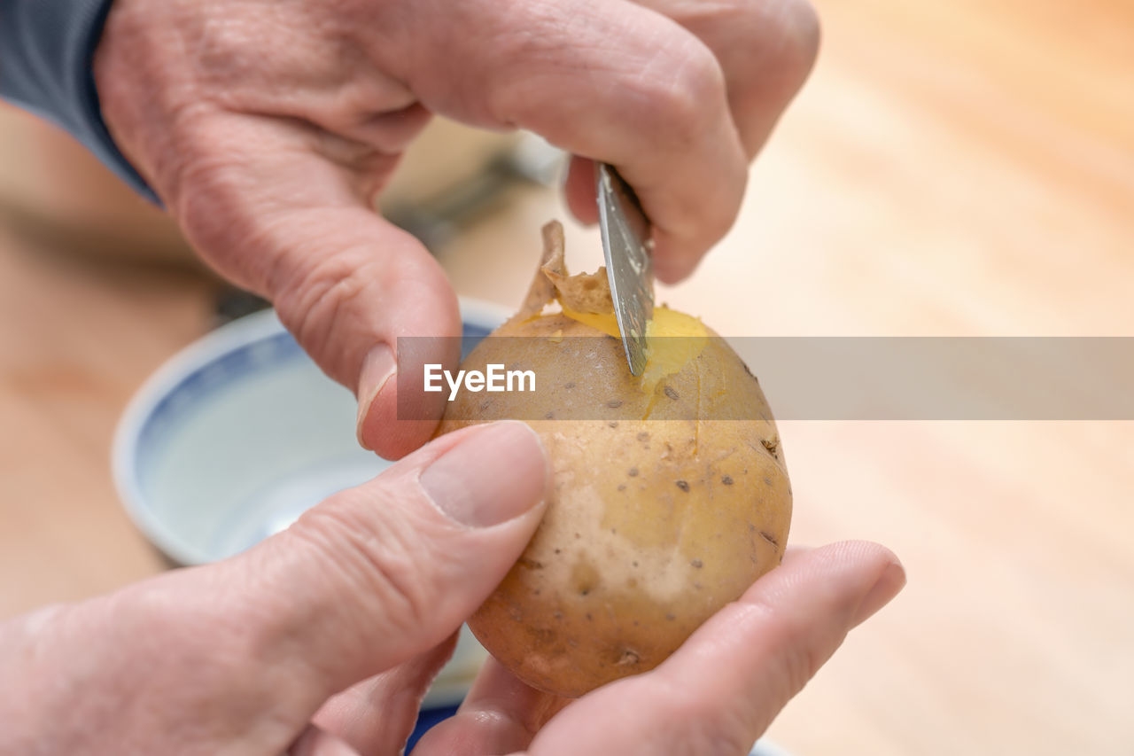 hand, food, food and drink, holding, adult, produce, one person, indoors, baked, close-up, freshness, wellbeing, healthy eating, raw potato, men, focus on foreground