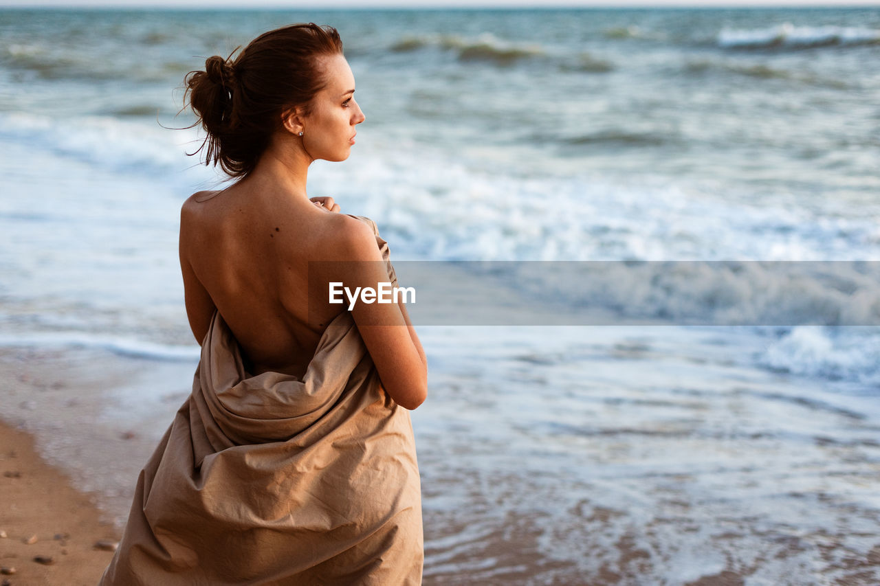 Woman standing at beach