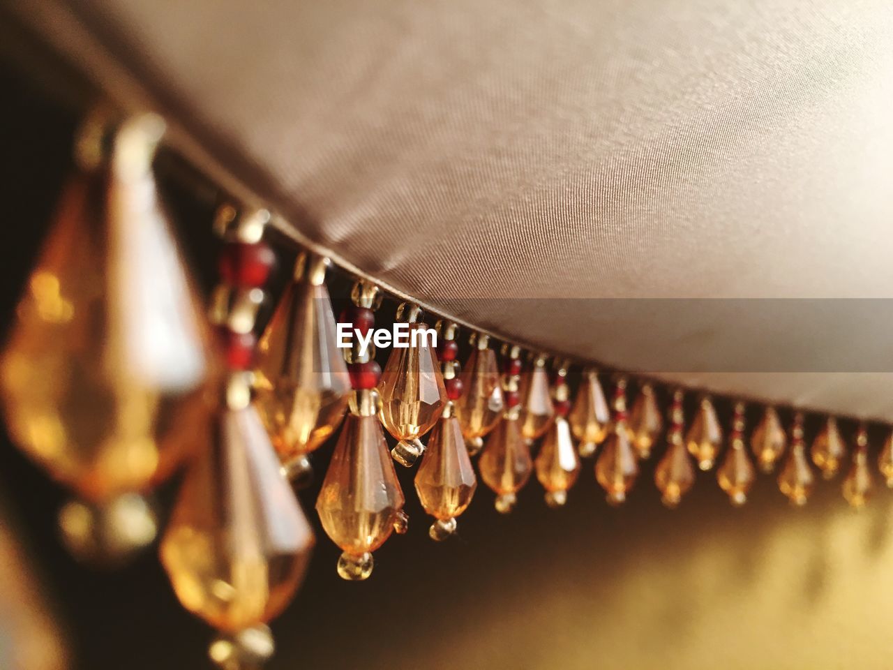 Close-up of crystals hanging from lamp shade