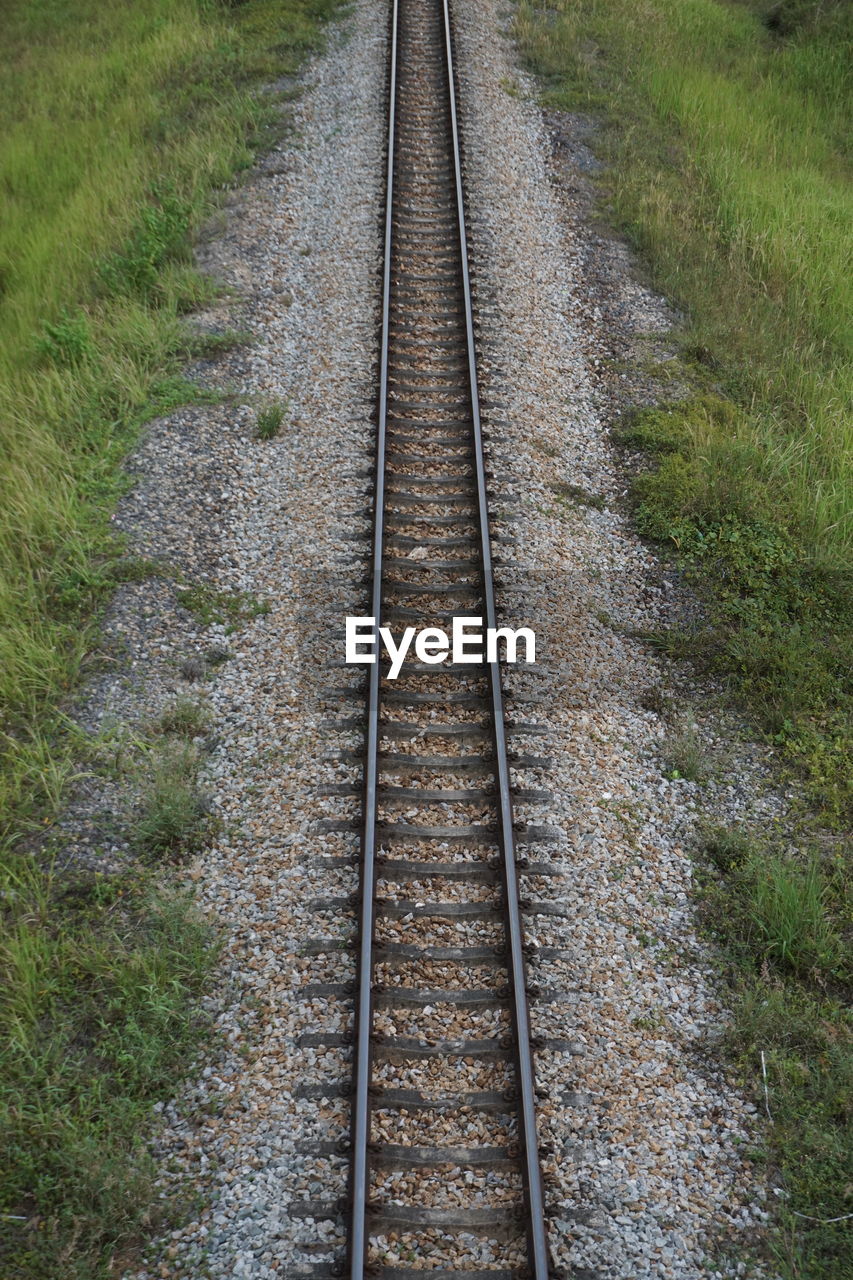 High angle view of railroad tracks on field