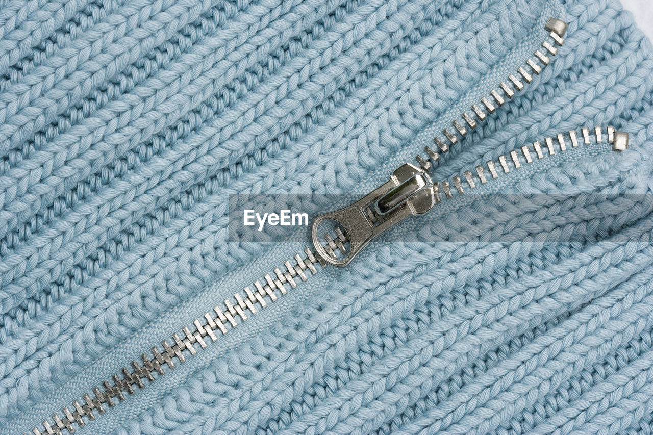 Close-up of sweater zipper
