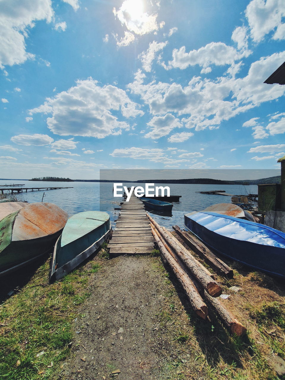 Scenic view of sea boat against sky