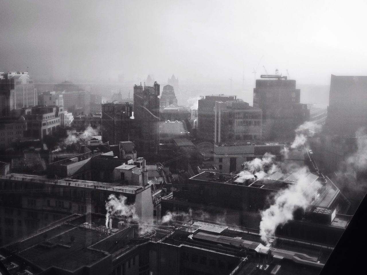 High angle view of industries emitting smoke