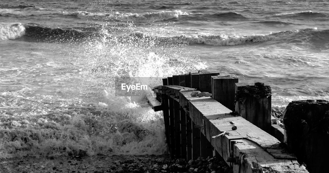 Wooden posts at beach