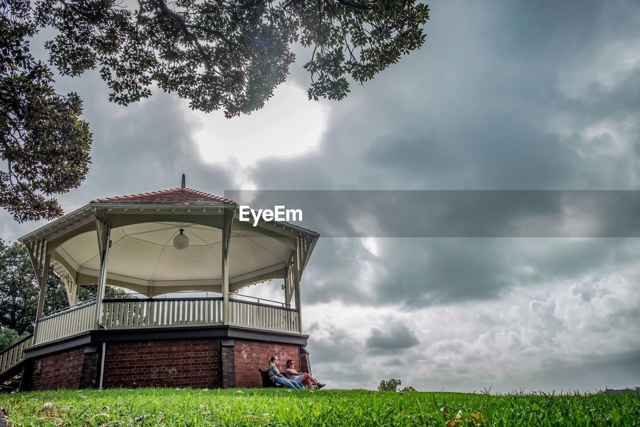 Low angle view of storm clouds over landscape