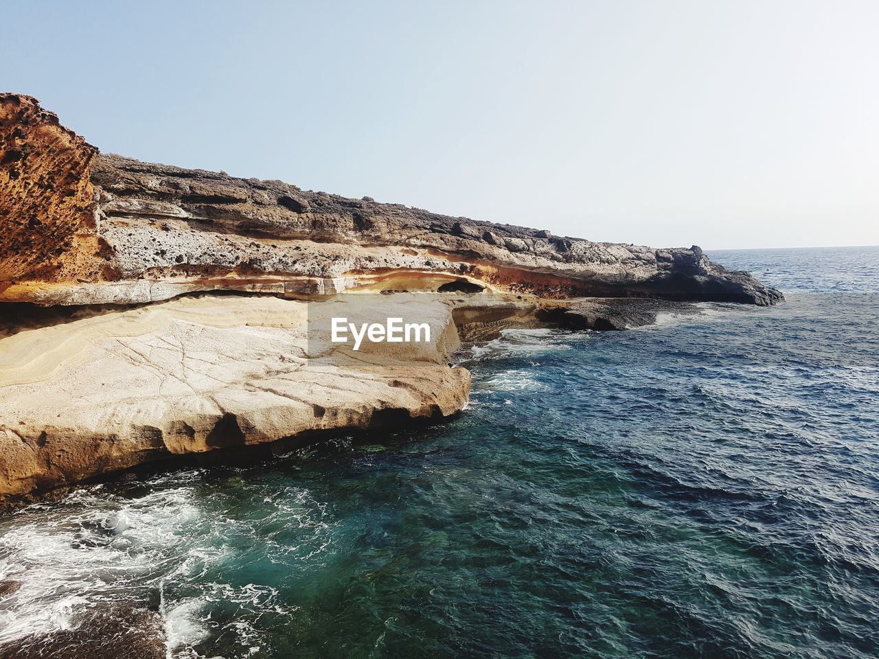 Scenic view of sea against clear sky