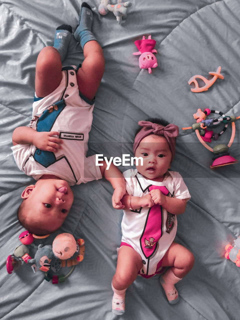 HIGH ANGLE VIEW PORTRAIT OF MOTHER AND BABY