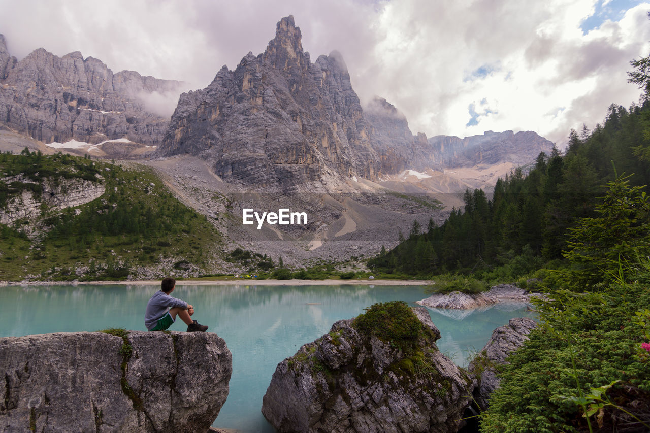 Scenic view of lake against cloudy sky