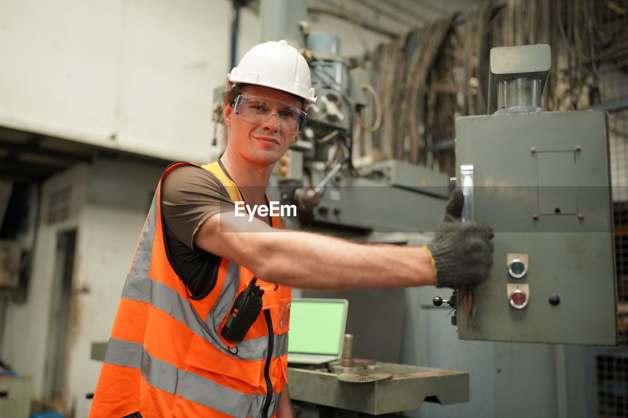 portrait of man working at factory
