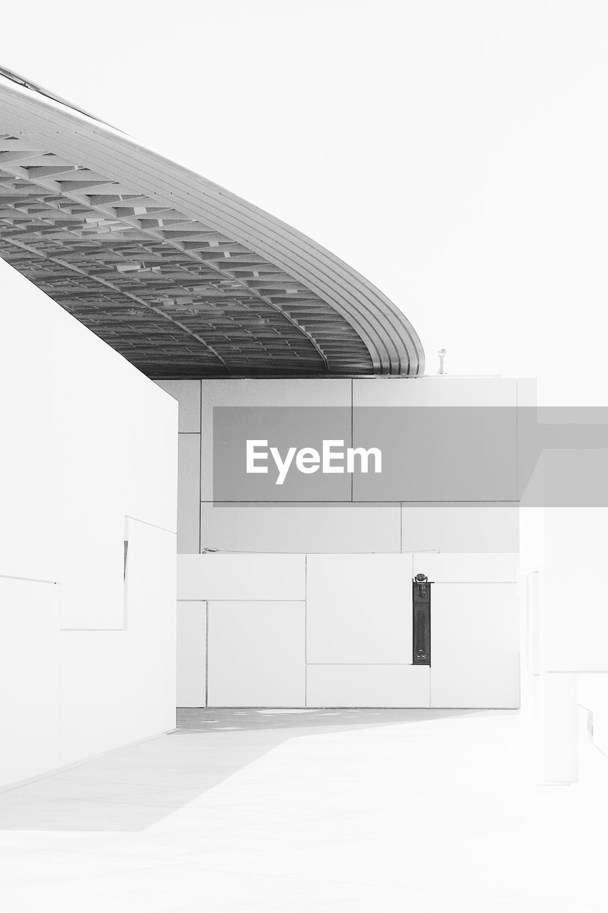 WHITE BUILDING AGAINST SKY