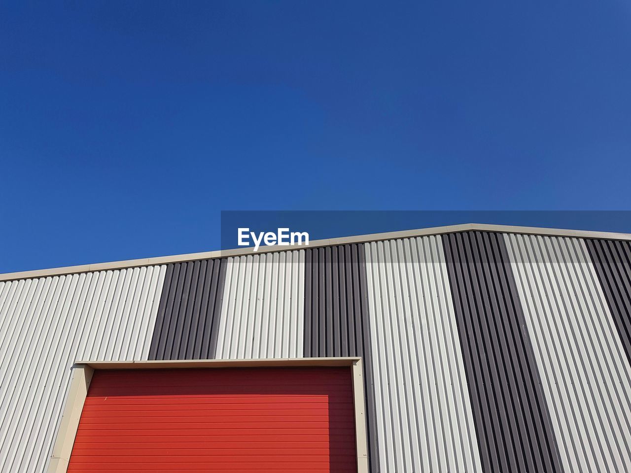 Low angle view of building against blue sky