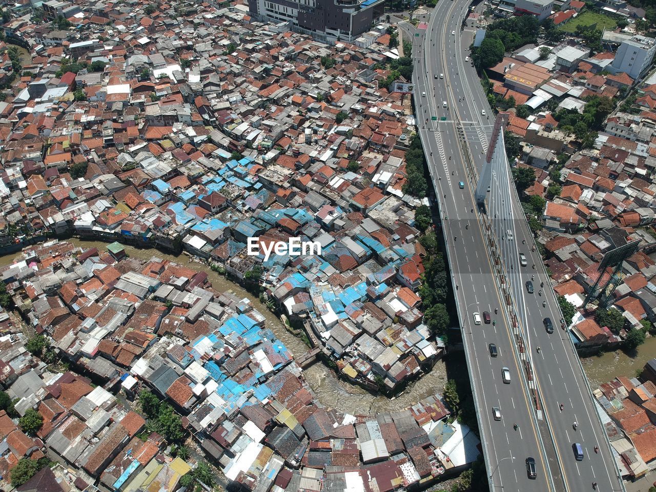 HIGH ANGLE VIEW OF BUILDINGS SEEN THROUGH ROAD