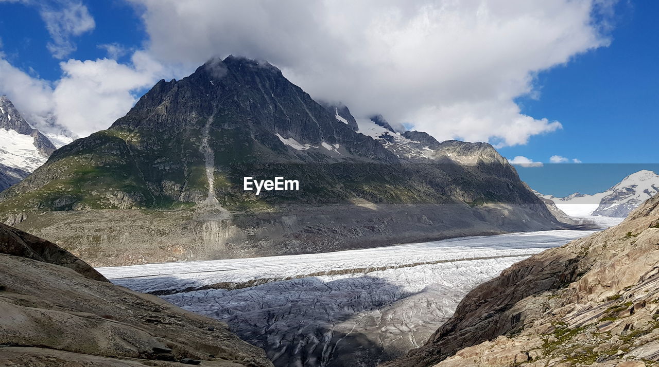 Aletsch glacier in the swiss alps with snowcapped mountains against sky