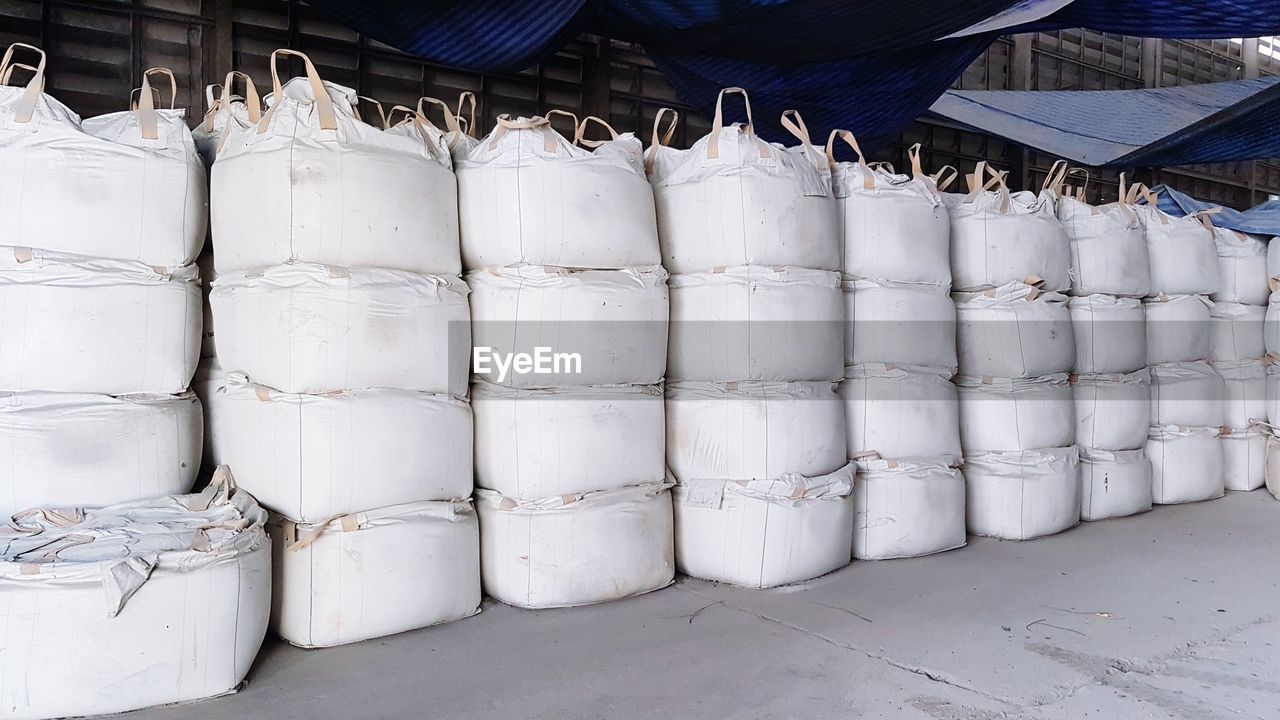 Stacked of bags on floor