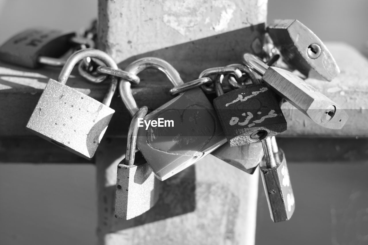 Close-up of love locks on bridge