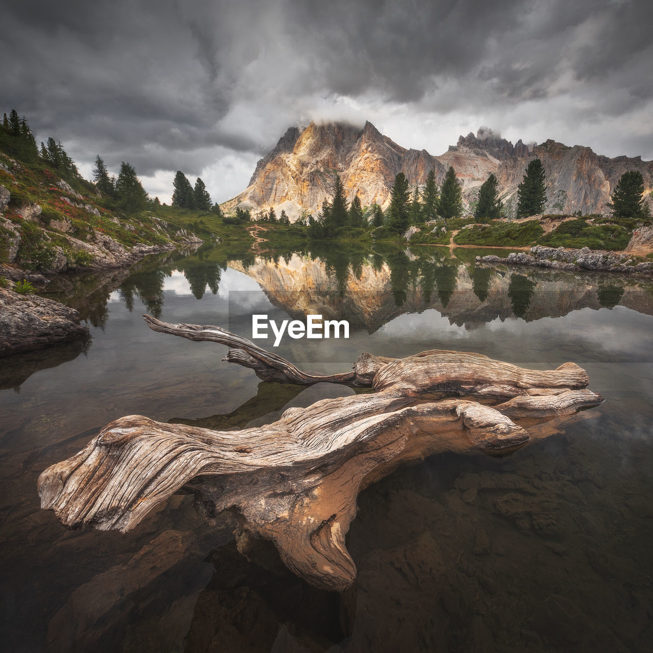 Moody landscape with dolomite mountains in perfect sunset light.