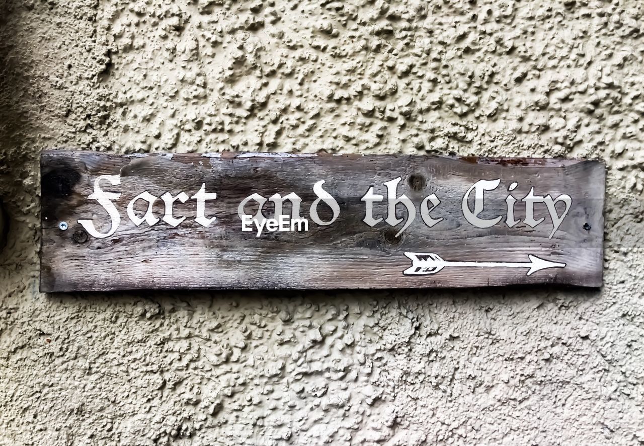 CLOSE-UP OF TEXT ON WOOD