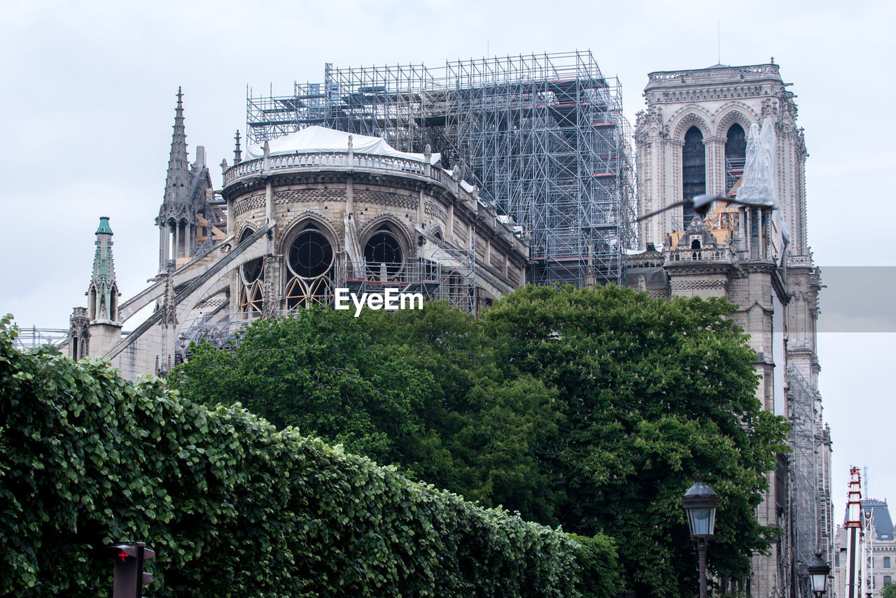 View of historic building notre dame against sky after fire 