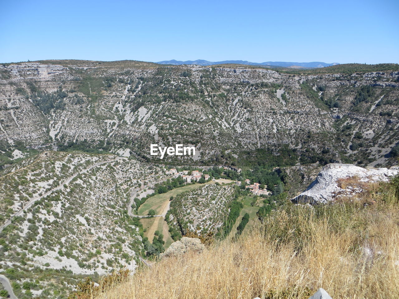 SCENIC VIEW OF ROCKS AGAINST CLEAR SKY