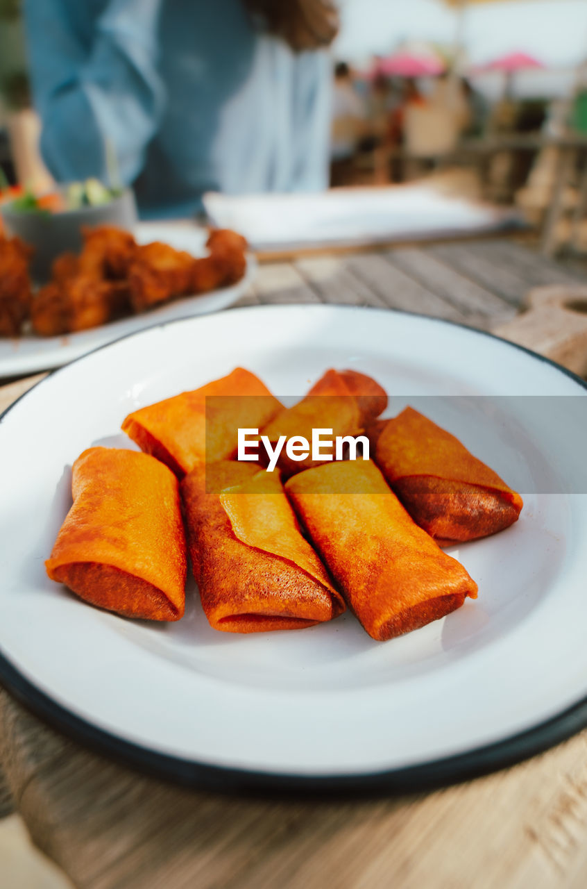 Close-up of snacks in plate on table